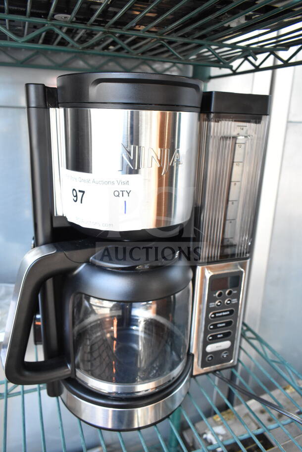 Ninja CE451 countertop coffee machine, black and stainless steel, 120V, digital control panel, visible brand label.