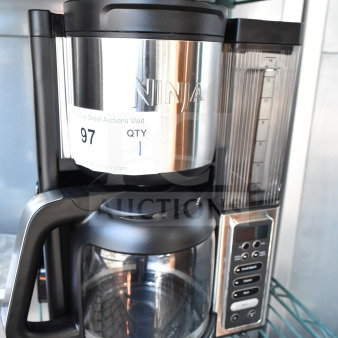 Ninja CE451 countertop coffee machine, black and stainless steel, 120V, digital control panel, visible brand label.