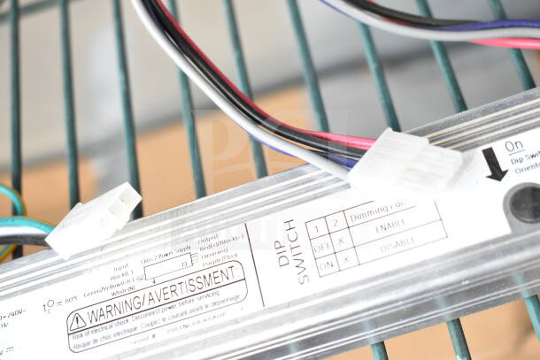 General Electric LED Driver with dip switches and wiring visible, labeled for power and dimming functions.