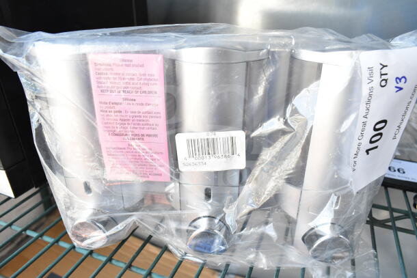 3-chamber wall-mounted dispenser, satin silver with translucent bottles, ProTerra logo, model 36334-PROT, sealed.