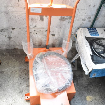 Brand new Fryclone oil caddy with minor scratches and dents. Orange frame, black hoses; protective wrap on handles.
