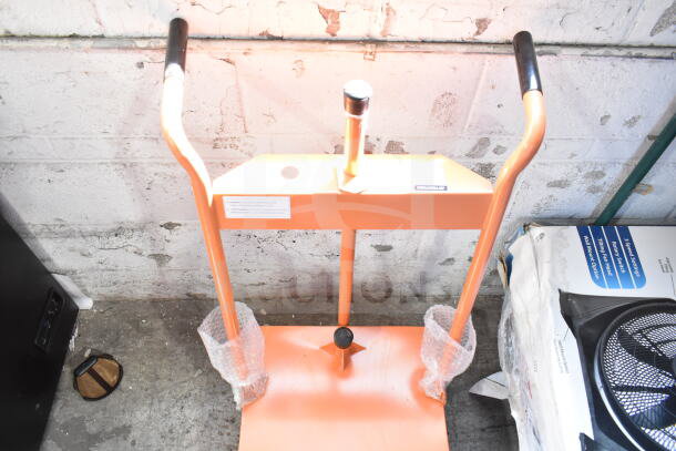 Brand new Fryclone Oil Caddy with minor scratches and dents. Orange frame, black handles. Tags indicating brand affixed.