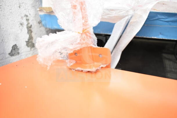 BRAND NEW Fryclone Oil Caddy with slight scratches and dents. Orange surface, wrapped in protective film.