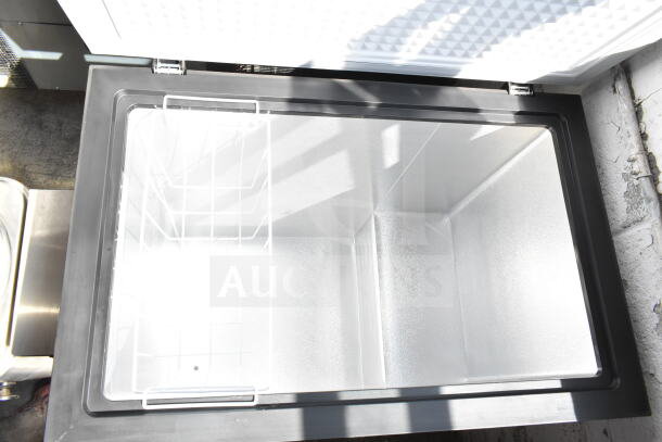 Frigidaire FGFRF7009-BLACK chest freezer, open view, 115 Volts, 1 Phase, pristine interior, black finish, one basket included.