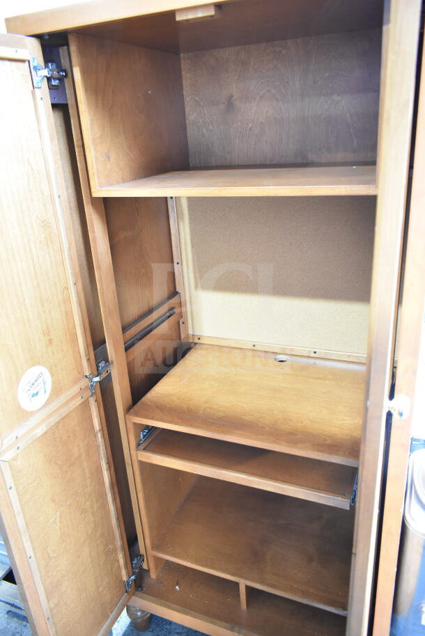 Wood pattern 2-door cabinet with shelves, natural finish. In good condition. Interior features adjustable shelving.