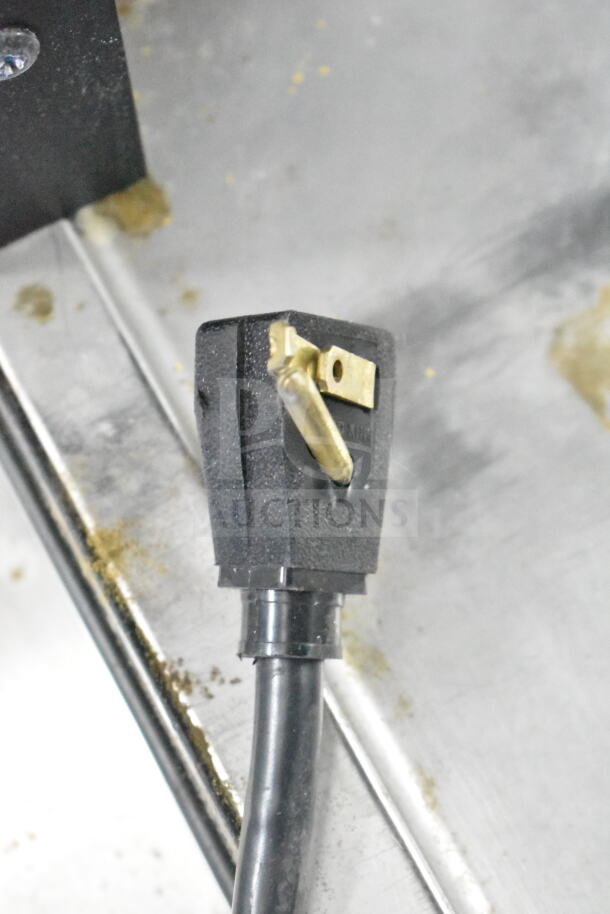Close-up of the power cord plug for a 2022 True T-35-HC Commercial 2 Door Reach In Cooler; 115 volts, 1 phase.