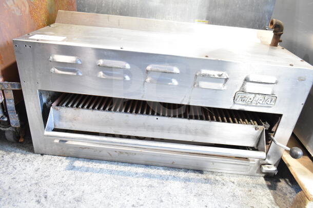 Imperial Commercial Gas Powered Cheese Melter, stainless steel, pre-owned, visible rust and wear, Imperial logo on front.