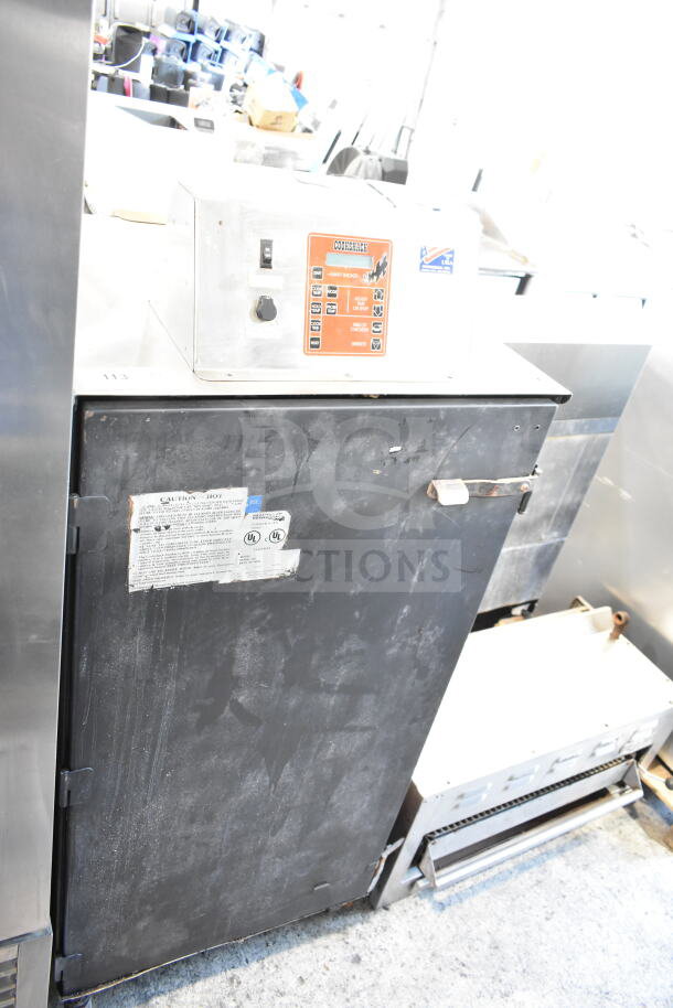 CookShack 250 Commercial Electric Smoker Cabinet, 208 volts, in used condition with visible labels indicating model and safety info.