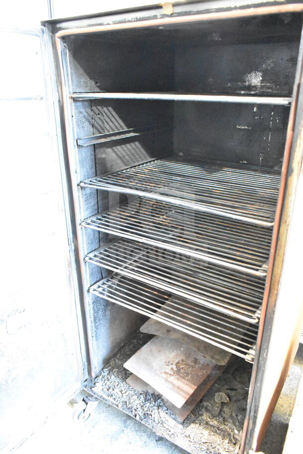 CookShack 250 Commercial Electric Smoker Cabinet with 208 volts, featuring multiple shelves, in used condition.
