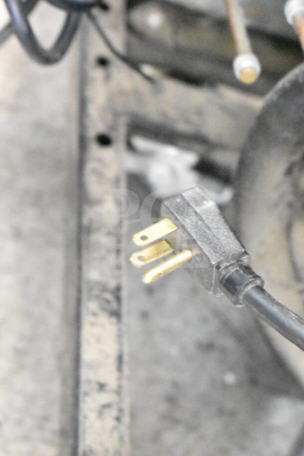 A 2017 True T-35-HC commercial 2-door reach-in cooler, 115 volts, 1 phase. Power plug and wiring visible.