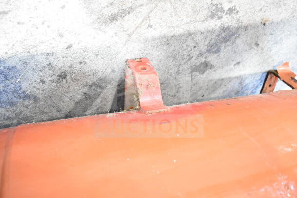 Craftsman air compressor, metal frame detail, showing signs of wear with some rust. No visible labels or markings.