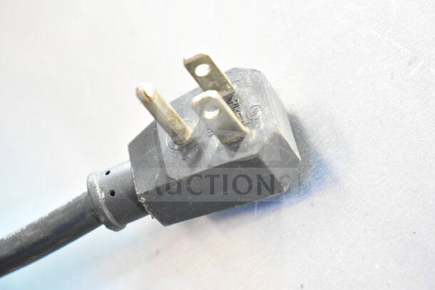Close-up of a black power plug for the Turbo Air TWR-48SD cooler, showing standard prongs for 115 volts, 1 phase use.