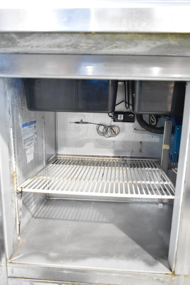Beverage Air SP72-30M Sandwich Prep Table, stainless interior, single shelf, visible wiring, 115V, used condition.