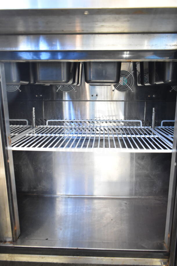 2020 Atosa MSF8308GR commercial salad prep table, stainless steel interior, wire rack, six top containers, clean condition.
