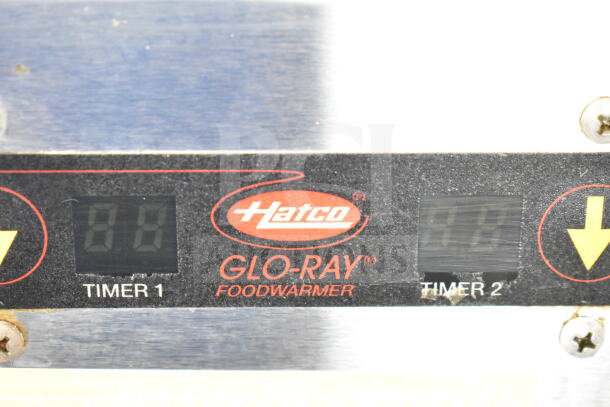 Hatco Glo-Ray food warmer control panel showing digital timers, branded logo, and operational buttons.