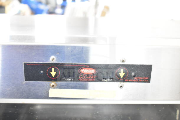 Hatco Glo-Ray commercial countertop heated display, model details on panel, 120 volts, 1 phase, timer controls visible.
