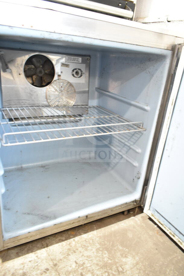 Delfield commercial single door undercounter cooler, 115 volts, 1 phase. Includes interior shelving, in used condition.