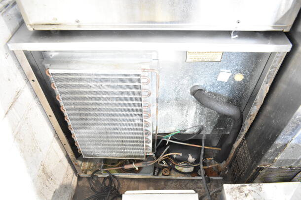 Delfield Commercial Single Door Undercounter Cooler, 115 volts, 1 phase, visible components inside, condition shows wear.