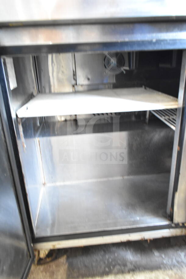 Atosa MSF8304GR commercial sandwich salad prep table with stainless interior, shelf, model MSF8304GR, on casters.