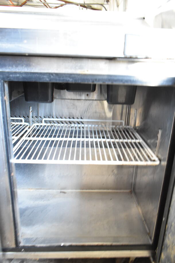 Atosa MSF8304GR Commercial Sandwich Salad Prep Table with wire shelving, stainless interior, and caster wheels. 115V, 1 Phase.