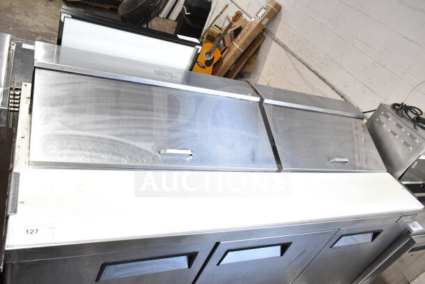 Atosa MSF8304GR commercial sandwich salad prep table in stainless steel. Features mega top and commercial casters. 115V, 1 Phase.