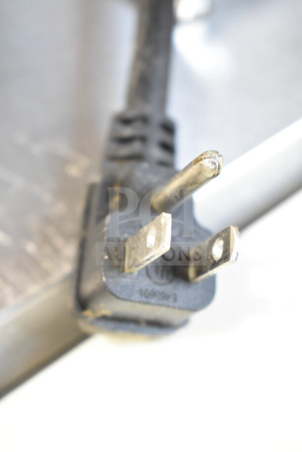Close-up of Atosa MSF8304GR power plug for commercial sandwich prep table, showing 3-prong configuration and standard wear.