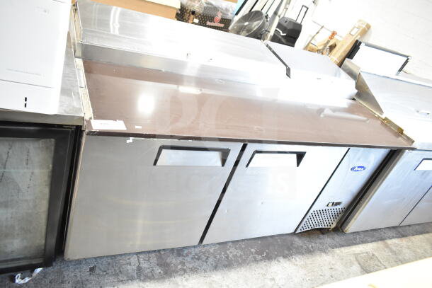 2018 Atosa MPF8202GR pizza prep table, stainless steel, on commercial casters, 115V, 1 phase. Signs of use visible.