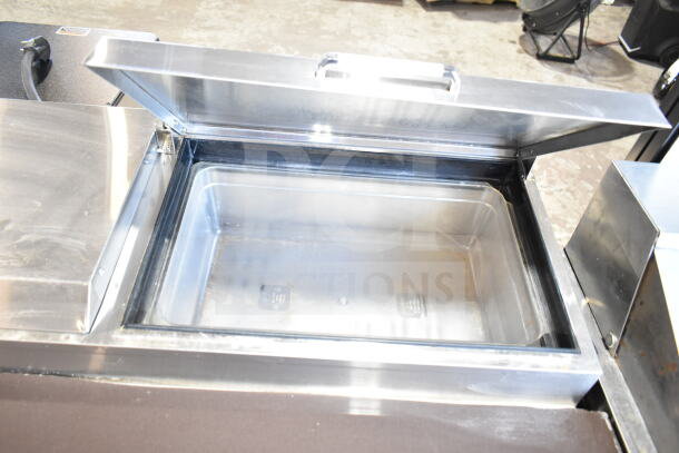 2018 Atosa MPF8202GR commercial pizza prep table, stainless steel with open top, on casters, 115 volts, 1 phase.