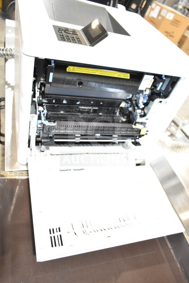 HP BOISB-1406-02 Countertop Printer, 100-127V, 1 Phase. Open tray, visible control panel. Good condition. Ideal for office use.