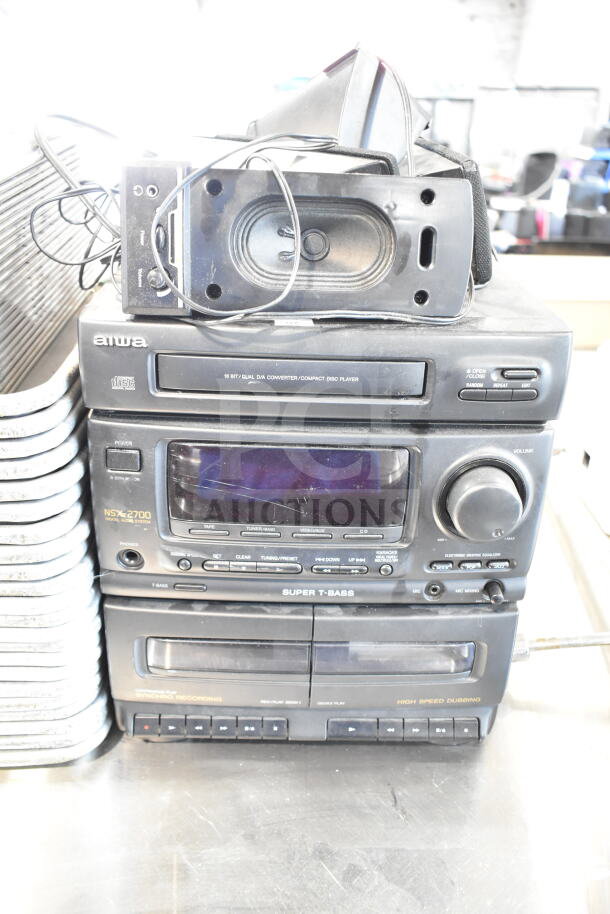Aiwa CX-N2700U stereo system with CD player and 4 speakers. Features Super T Bass and dual cassette decks. Model NSX-2700.