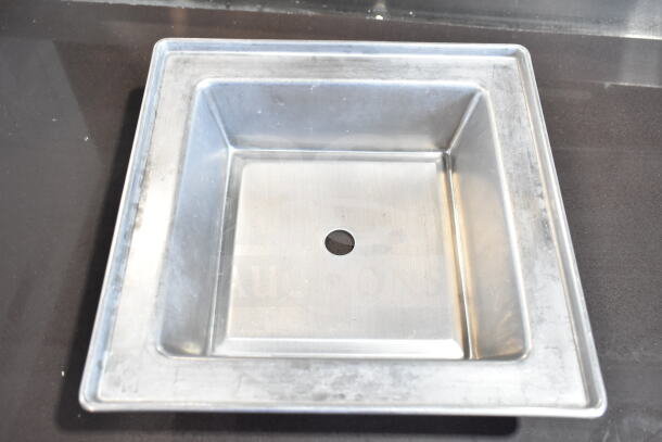 Square metal baking pan with center hole, slightly worn. Part of 45 various-sized baking pans auction.