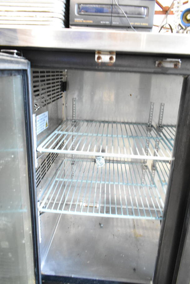 Spartan SGBBB-48 two-door back bar cooler, 115 volts, one phase. Interior view showing shelves and cooling vents.