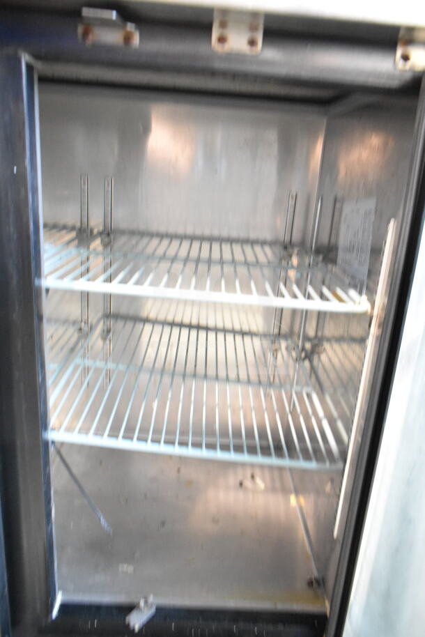 Spartan SGBBB-48 Commercial 2 Door Back Bar Cooler, 115V, 1 Phase. Interior shelving visible, used condition.