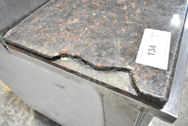 Cooltech commercial pizza prep table with stone cutting board, 6 drawers. Visible wear on surface. 120V, 1 phase. Tag "134".