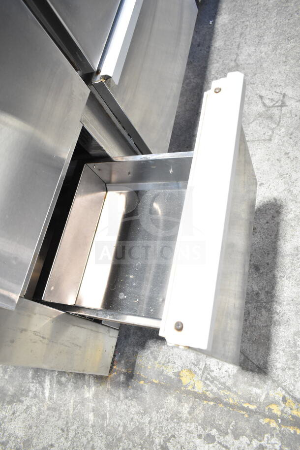 Cooltech commercial pizza prep table with stone cutting board and 6 drawers, 120V, 1 phase, stainless steel, open drawer shown.