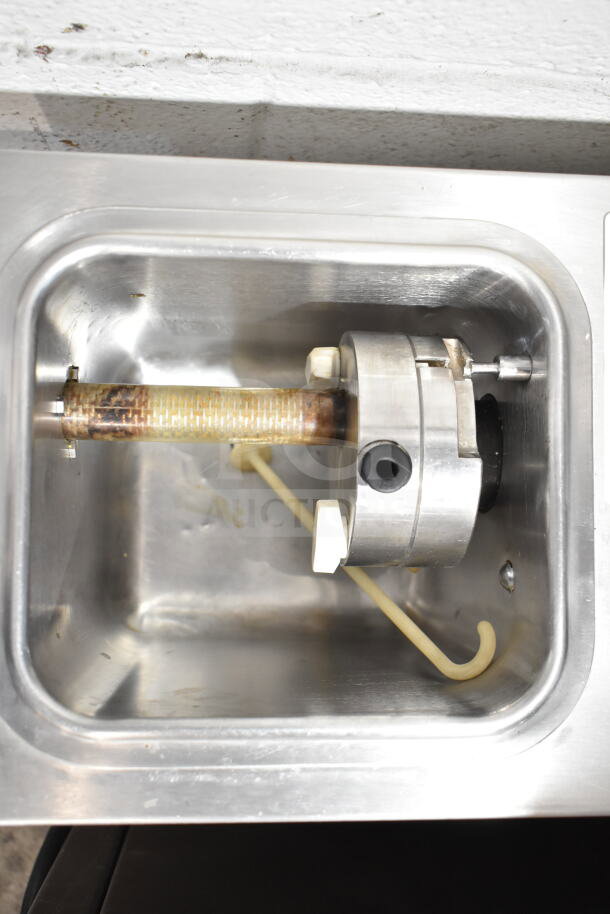 Coldelite commercial countertop whipped cream dispenser, 115 volts, 1 phase, stainless steel interior, used condition.