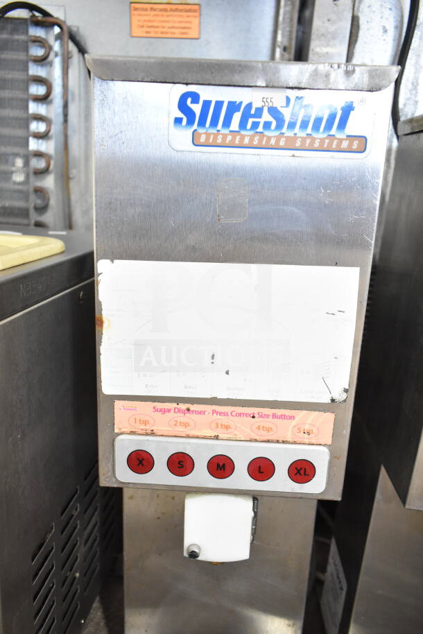 SureShot countertop sugar dispenser, 120 volts, 1 phase. Features size buttons. Used stainless steel condition.