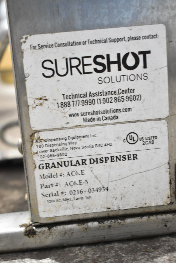 SureShot AC6.E countertop sugar dispenser, label shows model, part, and serial number. Made in Canada, 120V, 1 phase.