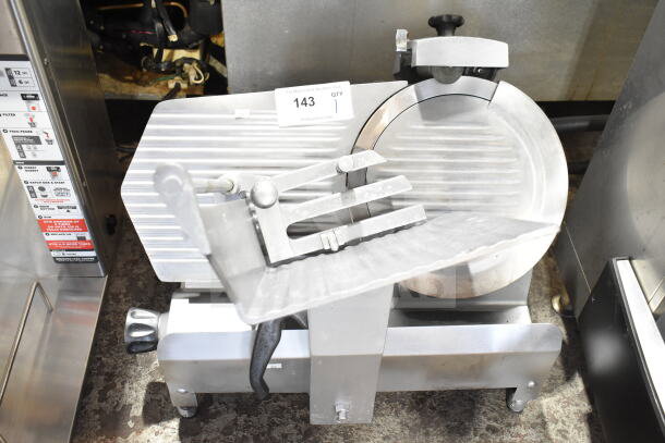 Commercial countertop meat slicer with integrated blade sharpener, 115 volts, 1 phase. Appears in good condition.