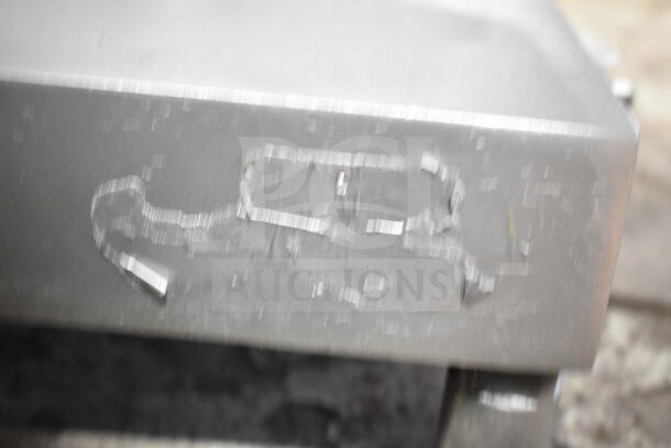 Commercial countertop meat slicer with blade sharpener, 115 volts, 1 phase. Durable construction, ideal for deli use.