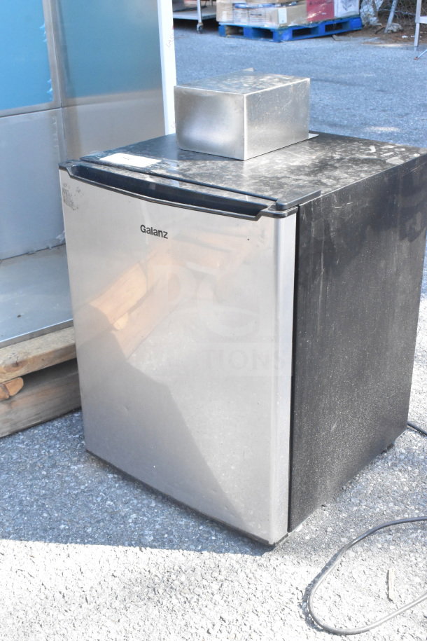 Galanz GL27BK Mini Cooler, stainless steel front, black sides, some surface dust, 115 Volts, 1 Phase, in used condition.