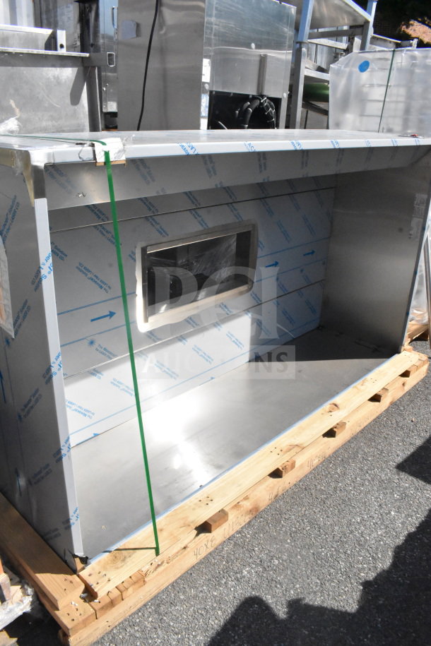 7' CaptiveAire 4824 VHB Commercial Steam Hood, stainless steel, new condition, protective film intact, on a pallet.