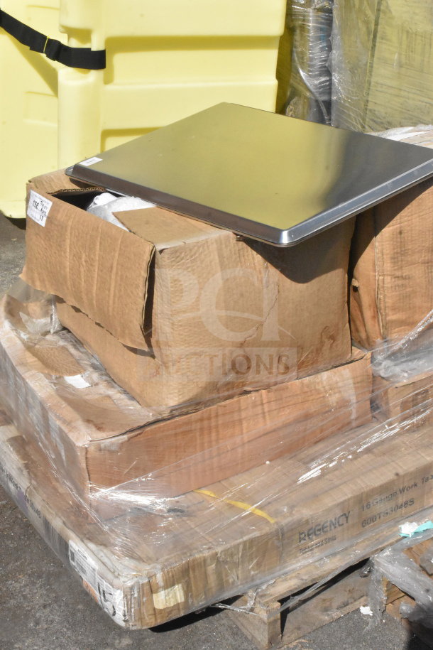 8 brand new scratch and dent items on a pallet, including a Regency 600TS3048S stainless steel work table box.