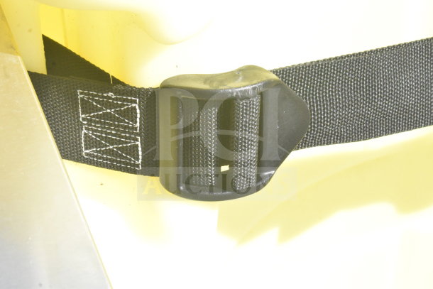 Brand new Uline H-1844 Poly Dolly, minor scratches, durable yellow material, black safety strap with plastic buckle.