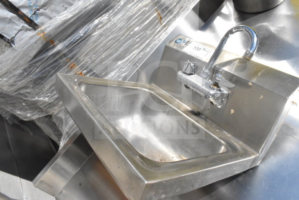 Stainless steel single bay wall mount sink with gooseneck faucet, used condition, visible wear and small dents.
