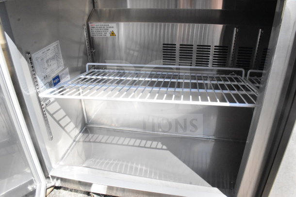 Alt text: Avantco 178SSWT60RHC 60" two-door worktop refrigerator, stainless steel interior, with wire shelving and 3 1/2" backsplash.
