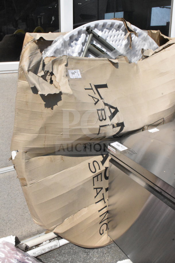 Lancaster Table & Seating folding table, brand new scratch and dent, visible packaging damage, labeled with item code.