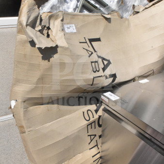 Lancaster Table & Seating folding table, brand new scratch and dent, visible packaging damage, labeled with item code.