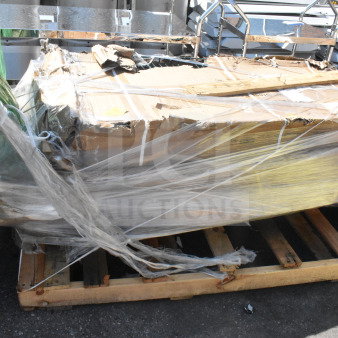 Four brand new scratch and dent auction items, including a pan rack and whiteboard, wrapped on a wooden pallet.