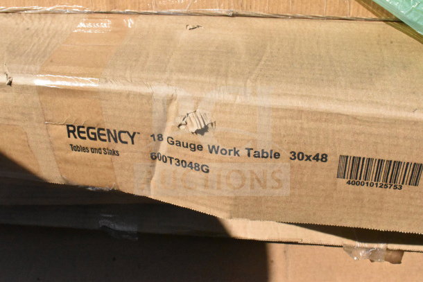 Brown box with Regency 18 Gauge Work Table, 30x48 markings, visible scratch and dent. Model 600T3048G. Barcode shown.